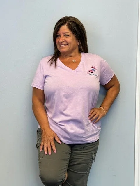 Ms. Medicare pink V-neck shirt
